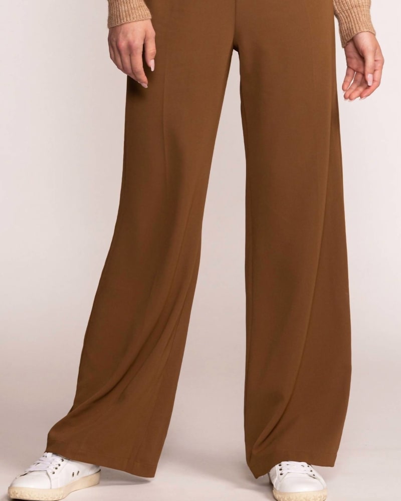 Front of a model wearing a size L Liliana Pant in Brown in Brown by PINK MARTINI. | dia_product_style_image_id:338590